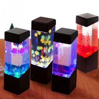Lampe méduse aquarium – quatre lampes aquarium allumées en couleurs différentes