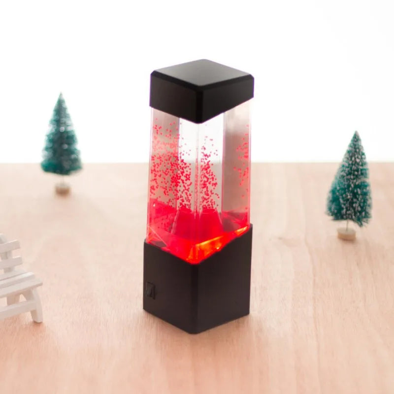 Lampe méduse aquarium – lampe aquarium à lueur rouge sur une table en bois