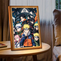 Cadre lumineux Naruto – cadre posé sur une table, scène de groupe allumée