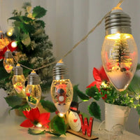 Guirlande sapin lumineuse boules à neige – ampoule au sapin miniature et ampoule au renne, sur une table de fête