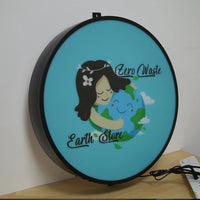 Caisson lumineux rond 50 cm LED à logo personnalisable – même exemple de logo sur fond turquoise