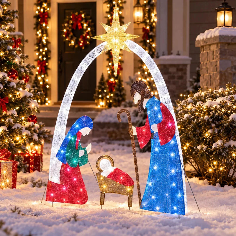 Crèche lumineuse – version multicolore allumée devant une maison décorée