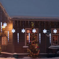 Rideau lumineux flocons et glaçons de Noël – rideau lumineux blanc froid sur une façade