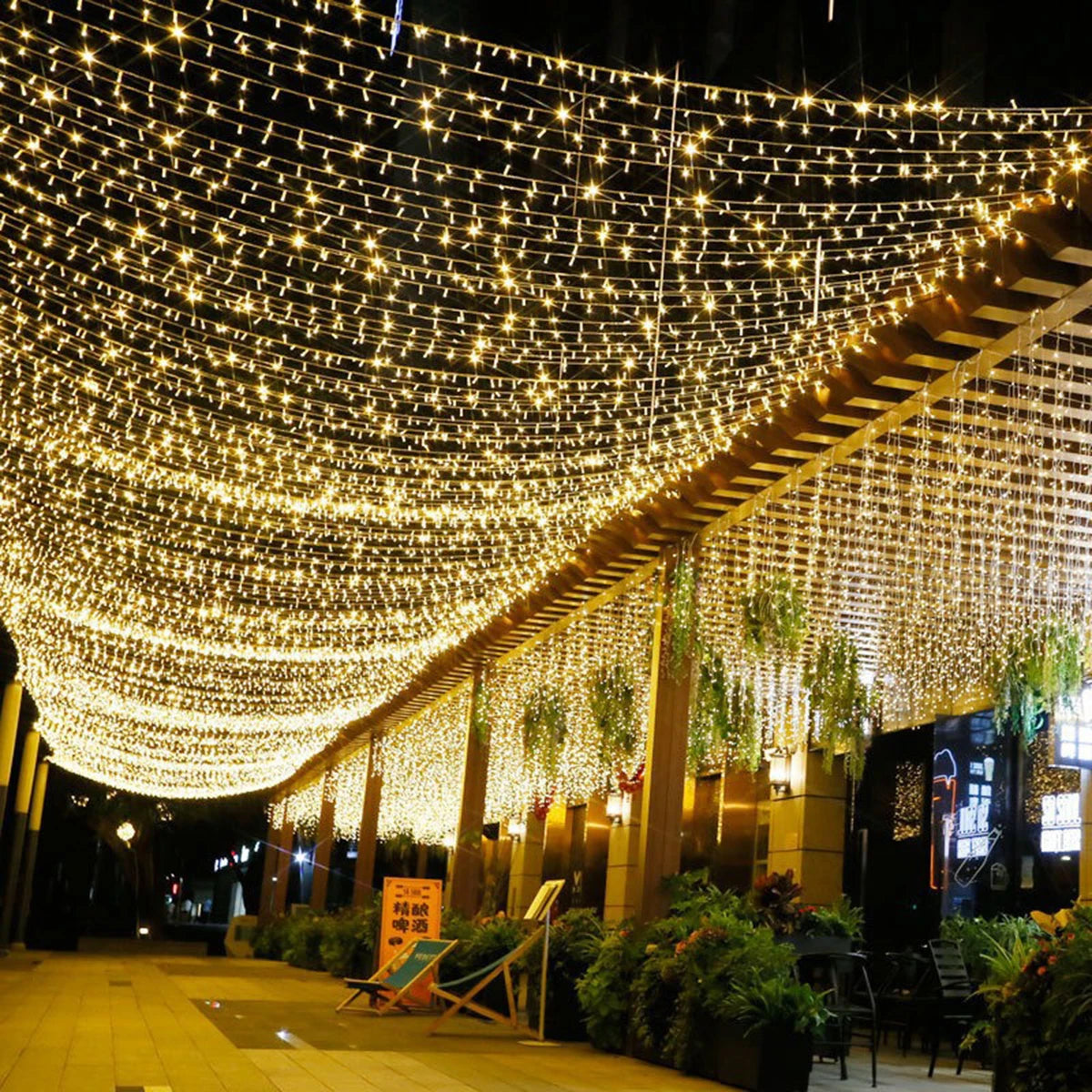 Guirlande lumineuse extérieur pro fil transparent – guirlande au-dessus d'une allée de commerces