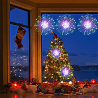 Guirlande lumineuse effet feu d'artifice – guirlande dans un sapin de Noël près d'une fenêtre