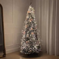 Sapin de Noël pliable pré-décoré lumineux – sapin allumé dans un angle de salon