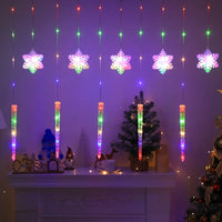 Rideau lumineux flocons et glaçons de Noël – flocons et glaçons multicolores sur une étagère