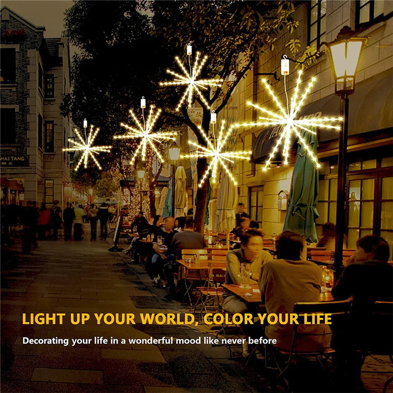 Étoile LED suspendue effet feu d'artifice – dans une rue de fête