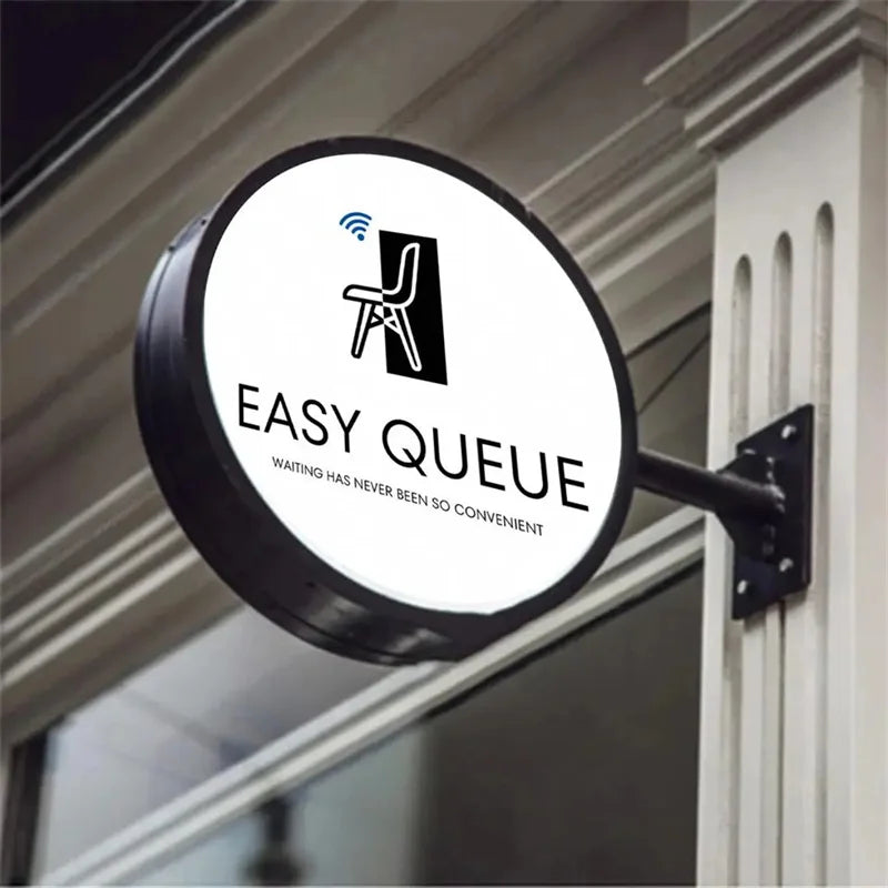 Enseigne drapeau ronde personnalisée – exemple de logo sur un caisson à cadre noir