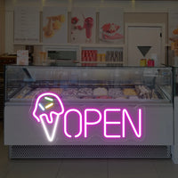 Enseigne néon OPEN cornet de glace – au-dessus d'une vitrine à glaces