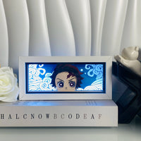 Tableau lumineux LED manga – Tanjiro aux motifs d'eau bleus, cadre allumé
