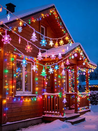 Guirlande lumineuse extérieur Noël à motifs – chalet enneigé décoré de la guirlande multicolore