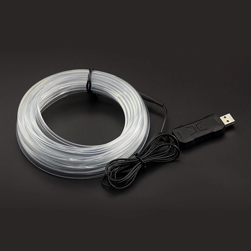 Bande lumineuse fibre optique – câble enroulé et boîtier USB sur fond sombre