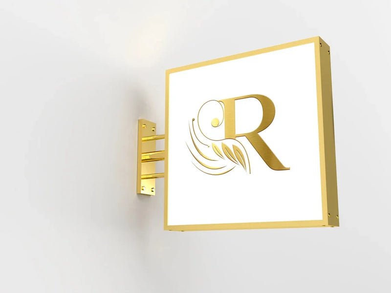 Enseigne drapeau ronde à logo – exemple de logo doré sur un caisson carré