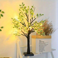 Arbre lumineux bouleau LED 61 cm – arbre à tronc noir près d'un sac en papier