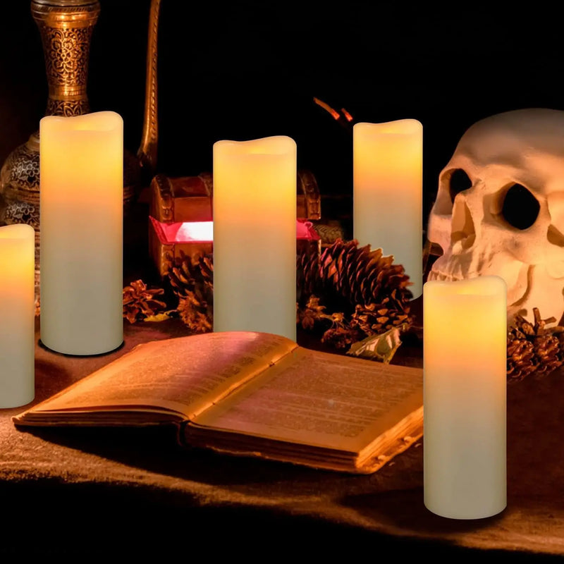 Bougies pilier LED ivoire – bougies pilier ivoire près d'un livre et d'un crâne décoratif