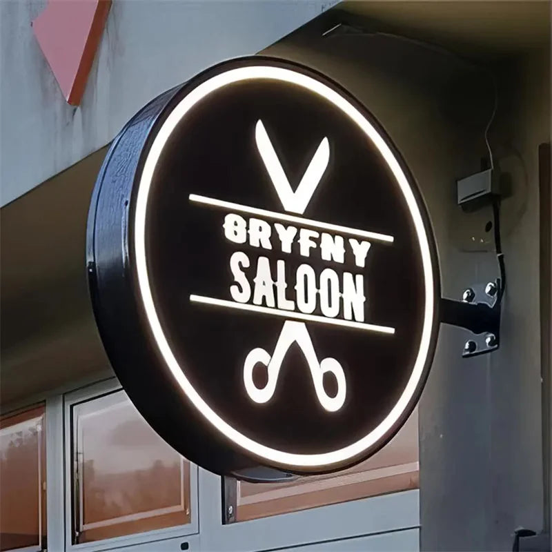 Enseigne drapeau ronde personnalisée – caisson allumé avec un logo de salon sur fond noir