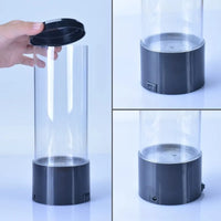 Aquarium méduse lumineux – tube transparent, couvercle retiré, détail du socle, de l'interrupteur et de la prise
