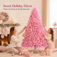 Sapin de Noël rose en PVC – enfants décorant le sapin rose près d'une cheminée