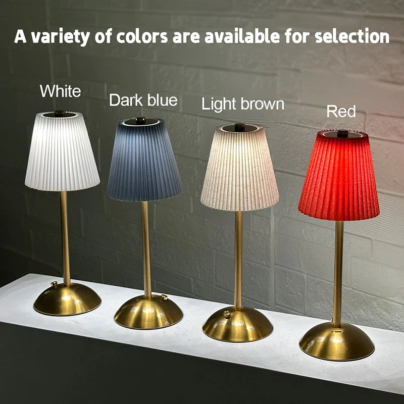 Lampe de table sans fil plissée – quatre coloris d'abat-jour alignés